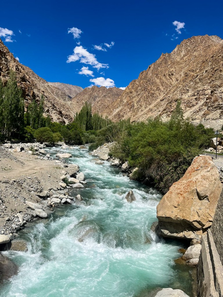 Turquoise mountain stream flowing through rocky valley between Hanu Thang and Hanu Yogma Aryan Valley